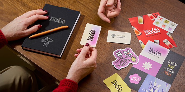 People interacting with print.