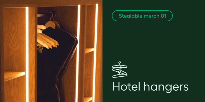 A composite photo of hotel hangers on the left side, with the text Stealable merch 01 and Hotel Hangers on the right side