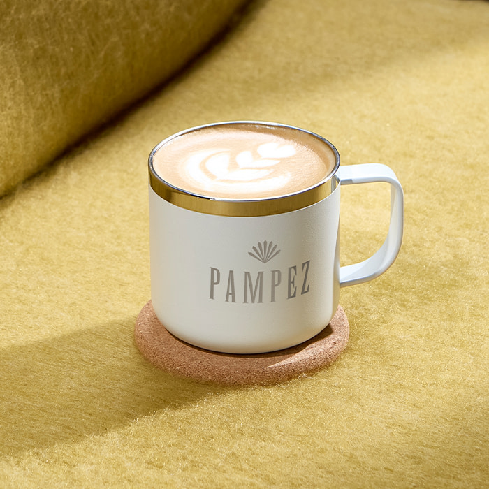 MOO Insulated Mug with coffee inside.