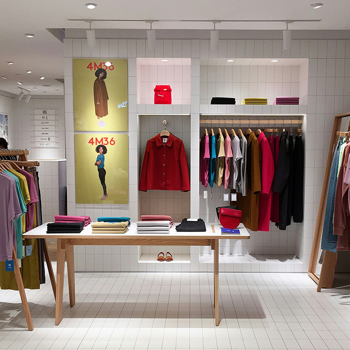 Branded clothing on display at a pop up.