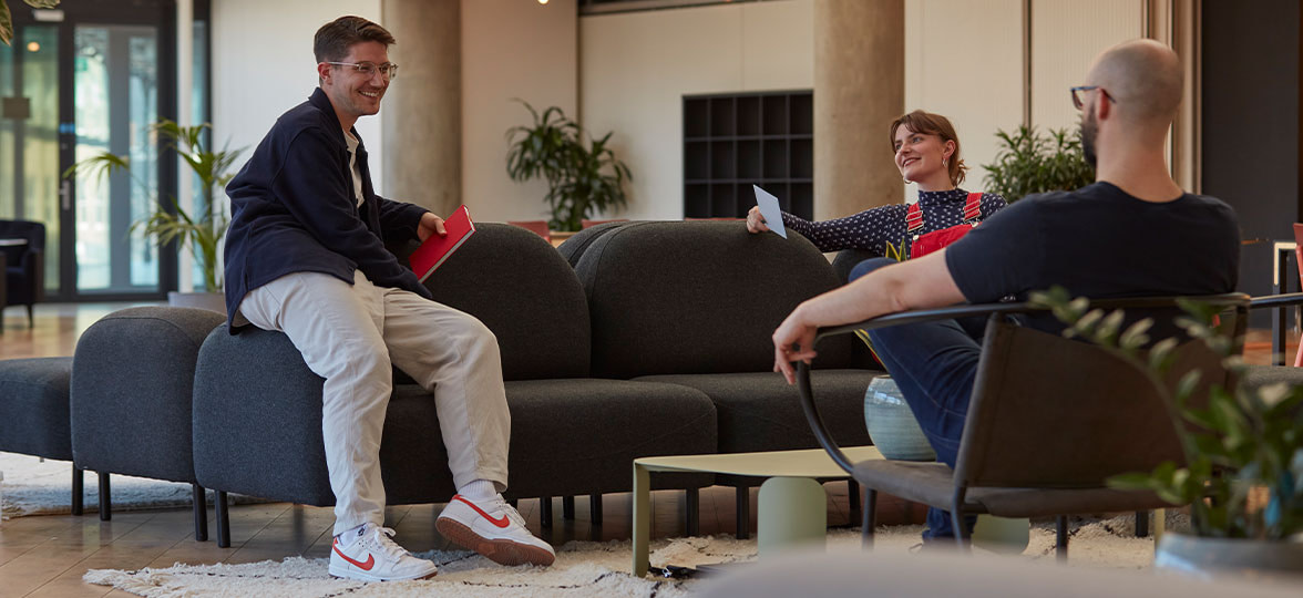 People interacting in office.