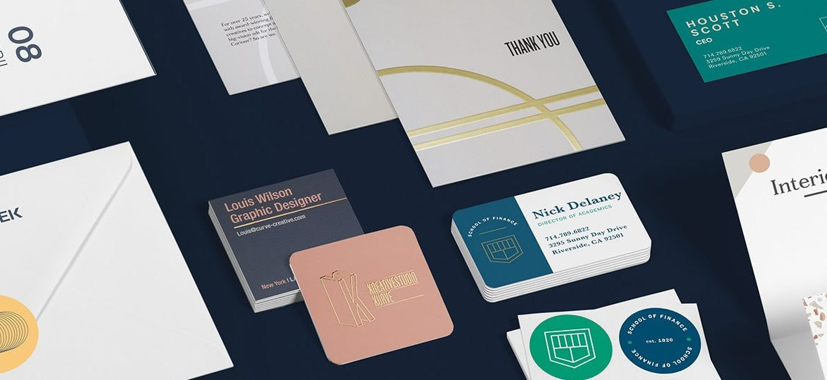 Set of print materials including flyers, postcards, business cards, and stickers