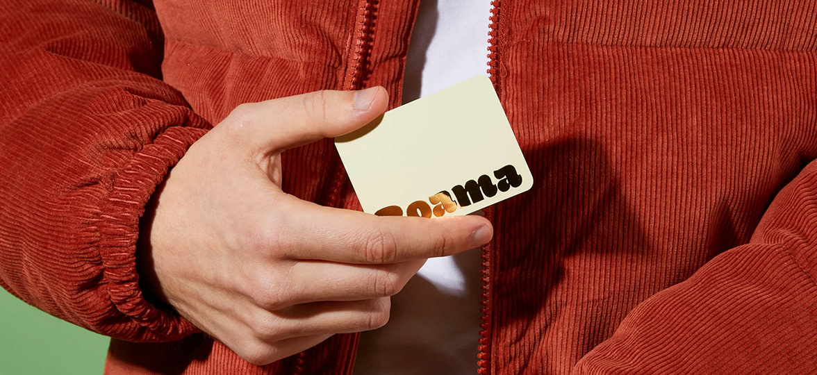 Business Card being held by person.