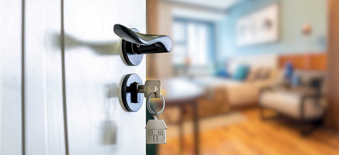 Opening the door with the keys to your new home