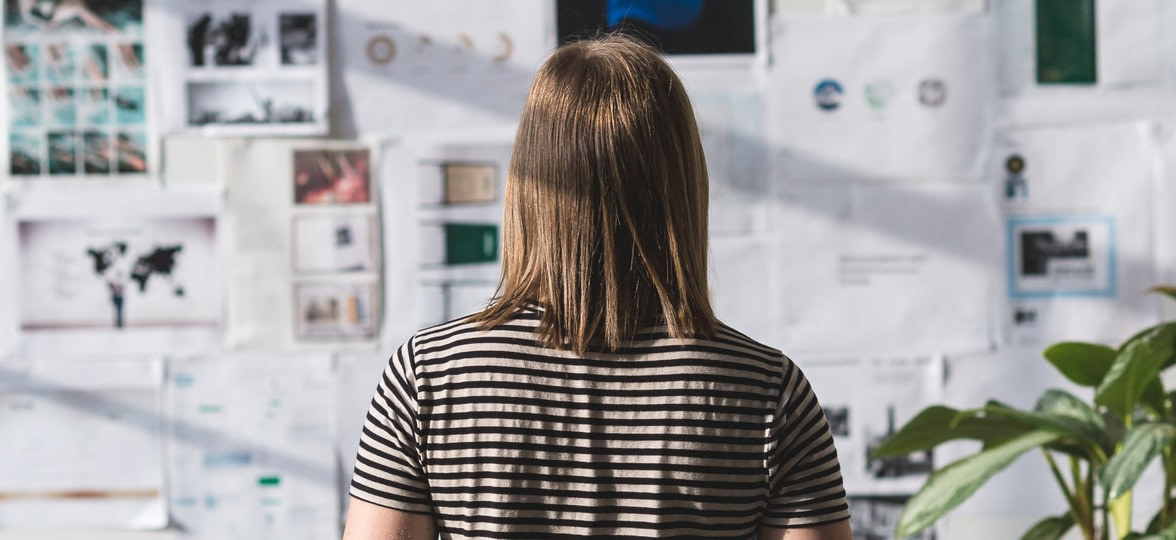 person looking at brainstorming board