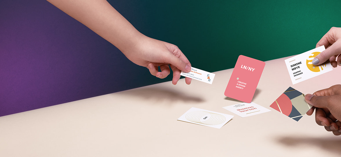 hands holding mini cards