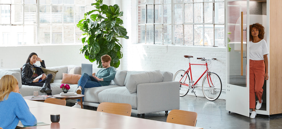 person working on laptop on the couch