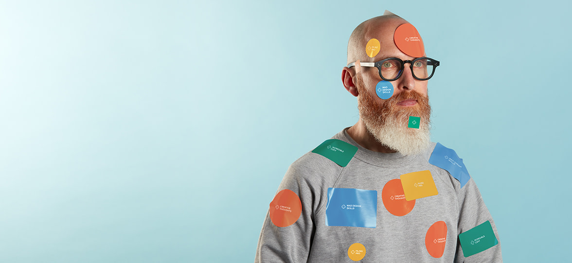 James North covered in MOO stickers in various shapes and sizes