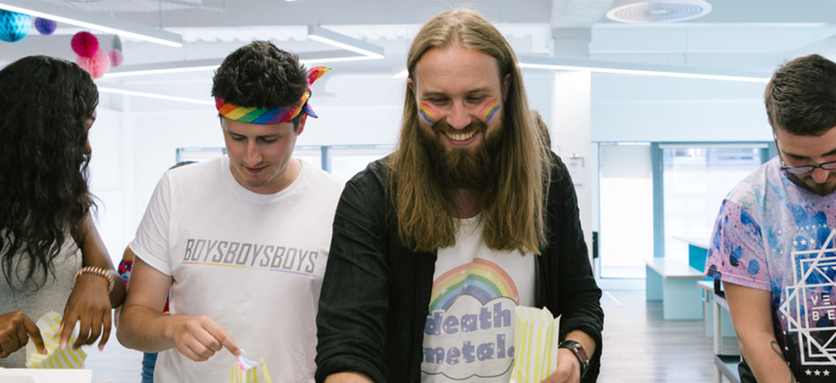 MOO employees celebrating pride and helping themselves to treats
