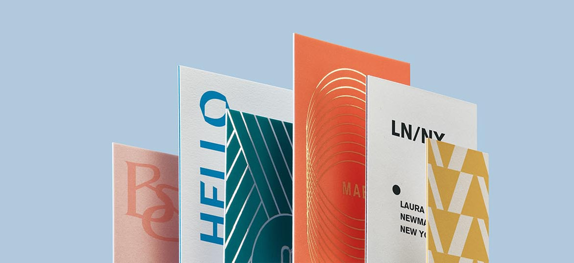 Six business cards standing in the shape of a bar chart
