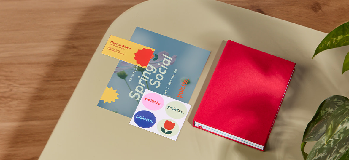 MOO stickers, notebook, business card laid out