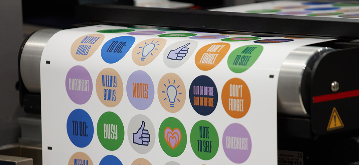 Custom sticker being printed inside the MOO factory