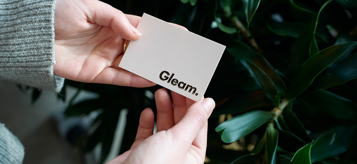 Velvet touch business card from MOO being held by a customer