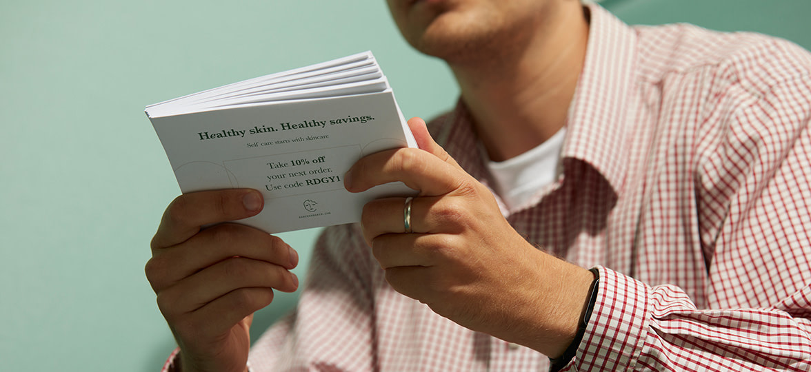 Paper Flyers being held by a business owner