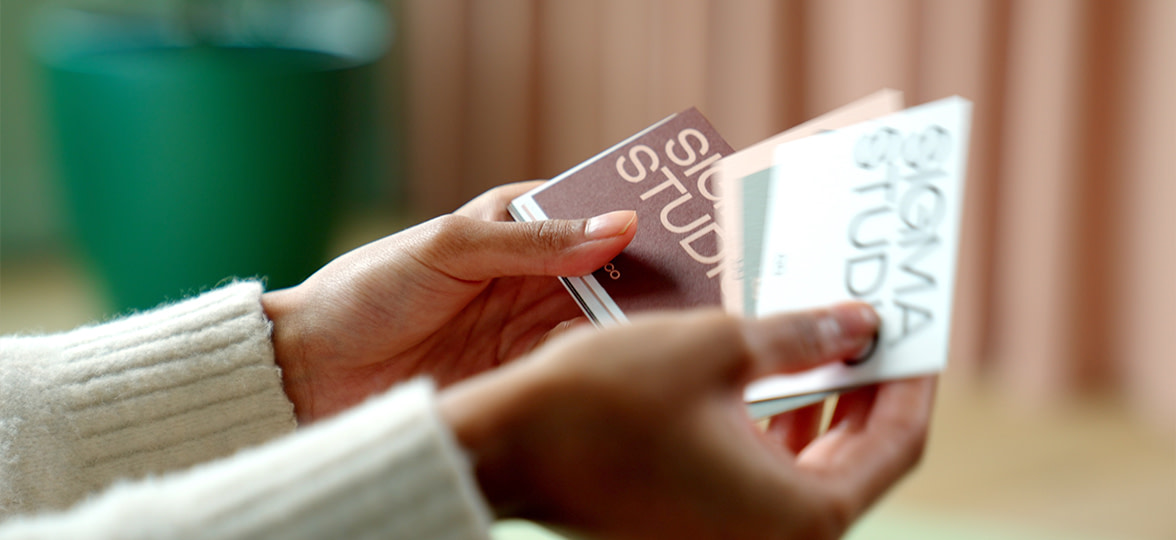 Business Cards being held by employee.