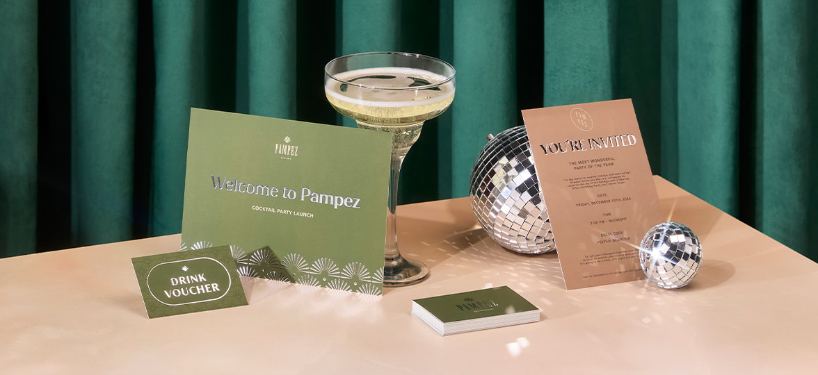 A gift card on a holiday-ready table with other MOO products