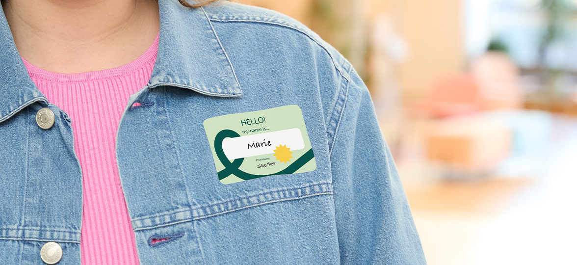 Person with sticker name tag.