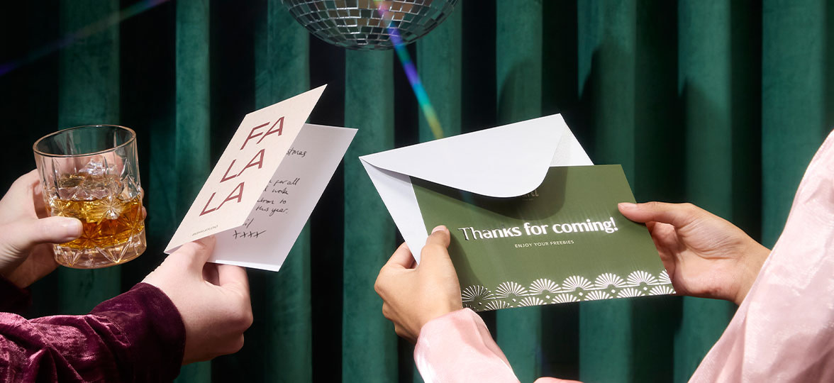 People holding a Postcard and a Greeting card.