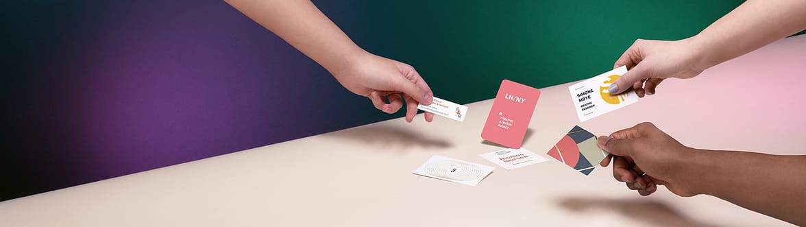 hands holding mini cards