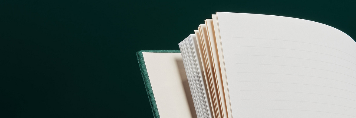 Alpine Green notebook open to a peach colored central page