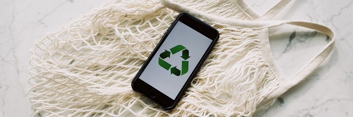 White net bag and phone with the recycling symbol