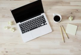 laptop on desk and coffee