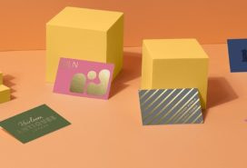 8 business cards in various colors with gold foil and silver foil designs