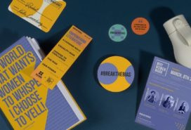 Event collaterals for an International Women's Day event including custom stickers, postcards, water bottle and notebook