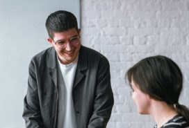 Two people talking in the office