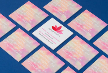 The Light and Lotus business cards laid flat