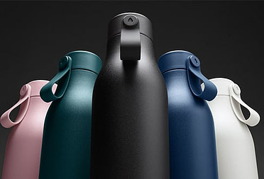5 MOO water bottles in different colors including pink, green, black, blue and white