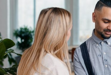 Two people talking at work