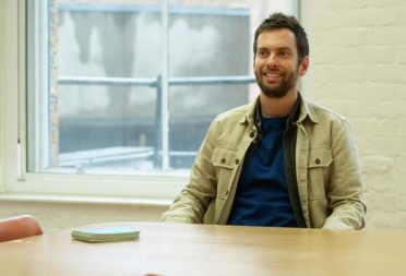 MOO employee Olivier Baumann sat at a desk