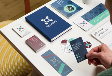 Custom print marketing materials as well as Notebook and Water Bottle designed by graphic design services team at MOO.