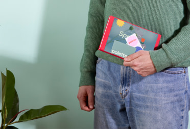 Quality branded merch from MOO, including a business card and stickers.