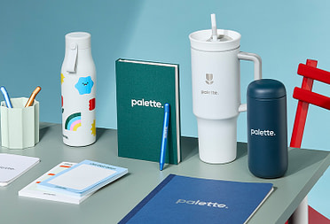 Custom branded merch bundle on desk.