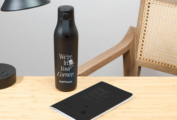 Water Bottle and Notebook on desk.