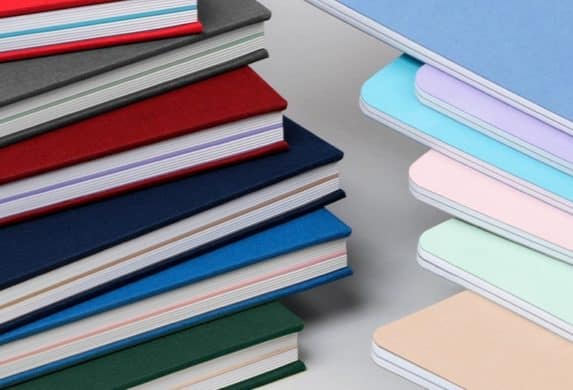 Soft and hard cover notebooks in various colors