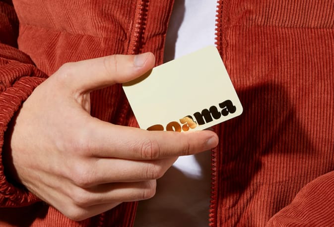 Business Card being held by person.