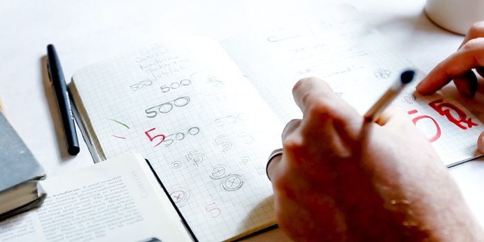Designer creating the new 500px logo