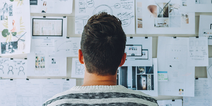 Person looking at an ideas wall