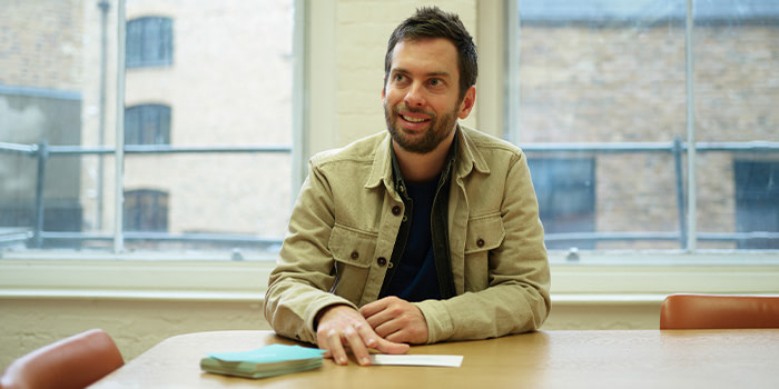 MOO employee Olivier Baumann sat at a desk