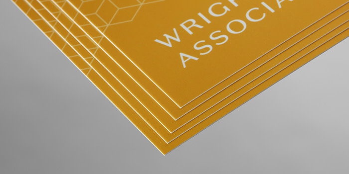 A close up of MOO Super business card, finished with soft touch lamination