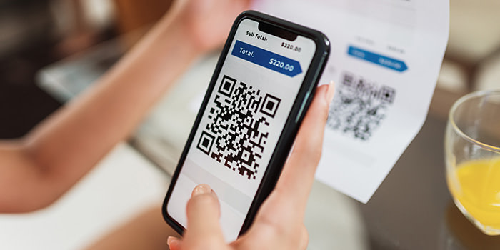 A QR code being scanned on a real estate document