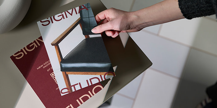 Two MOO postcards on a desk