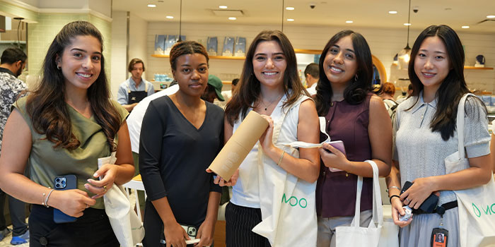 Guests posing with their MOO products.