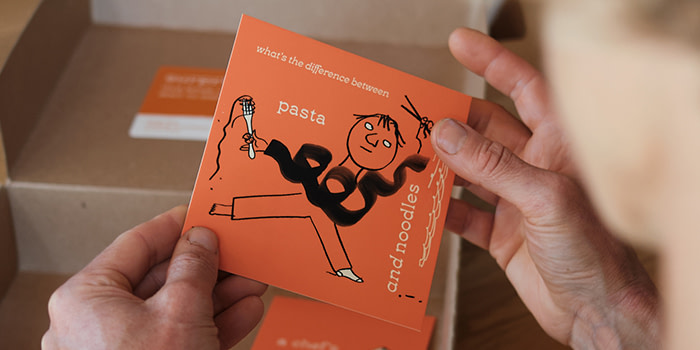 Tara holding a Luxe Notecard.