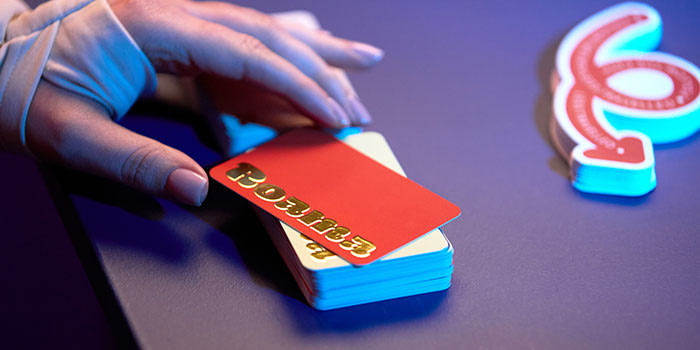 Person grabbing business card.