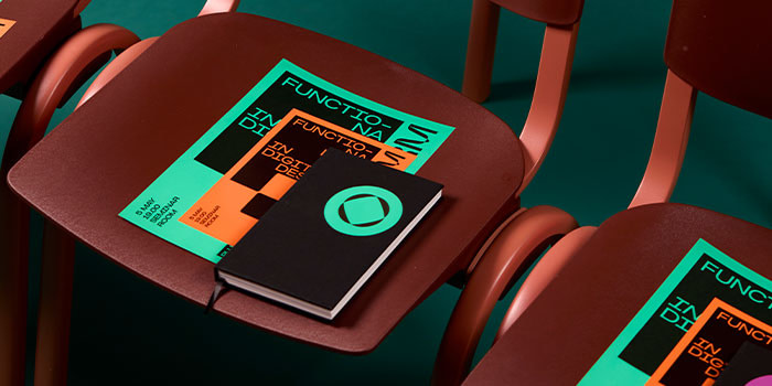 Flyer and Notebooks on chairs.