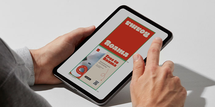 Person looking at Postcard proof on Ipad.